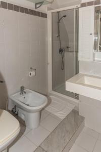 a bathroom with a sink and a toilet and a shower at Casa Lucio by Arbaspàa in Vernazza