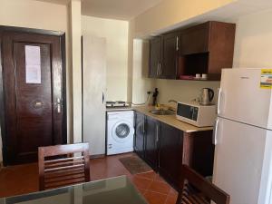 A kitchen or kitchenette at Amazing view apartment in Golf Porto Marina with marina access