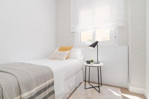 Posteľ alebo postele v izbe v ubytovaní iloftmalaga SoHo - Calle Martínez Campos