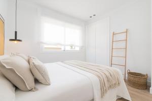Posteľ alebo postele v izbe v ubytovaní iloftmalaga SoHo - Calle Martínez Campos