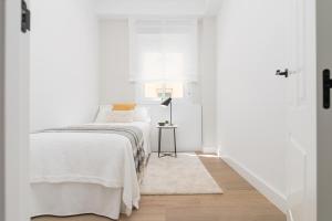 Posteľ alebo postele v izbe v ubytovaní iloftmalaga SoHo - Calle Martínez Campos