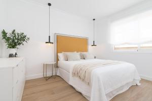 Posteľ alebo postele v izbe v ubytovaní iloftmalaga SoHo - Calle Martínez Campos
