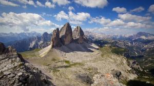 a mountain with tall rocks on top of it at Crioli Dolomiti Lodge in Villabassa