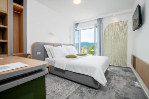 Postel nebo postele na pokoji v ubytování Hotel Villa Nova