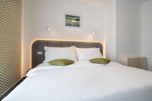 Postel nebo postele na pokoji v ubytování Hotel Villa Nova