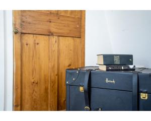 a laptop computer sitting on top of a refrigerator at Murphys House - 3 bed Luxury Central Townhouse in Bath +4 photos