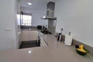 Kuchyň nebo kuchyňský kout v ubytování Naranjos Townhouse