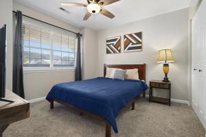 a bedroom with a bed and a ceiling fan at Eagle Nest Resort Pristine Dream in Branson +25 photos