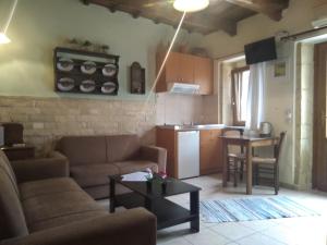 a living room with a couch and a table at Villa Orestis in Archanes