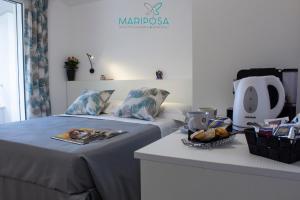 Postel nebo postele na pokoji v ubytování Affittacamere Mariposa