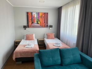 Posteľ alebo postele v izbe v ubytovaní Carina Hotel + 36 fotografií