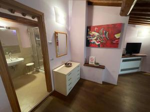 a bathroom with a sink and a mirror at Dimora Del Corso Di Montepulciano in Montepulciano +66 photos