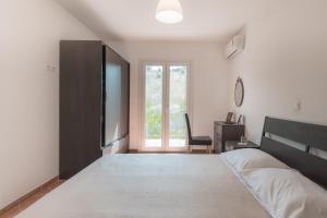 A bed or beds in a room at Villa Varka