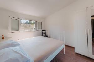 A bed or beds in a room at Villa Varka