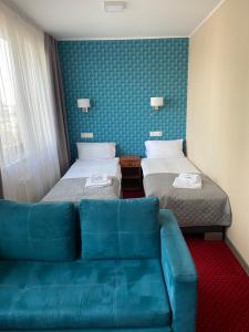 Postel nebo postele na pokoji v ubytování Carina Hotel