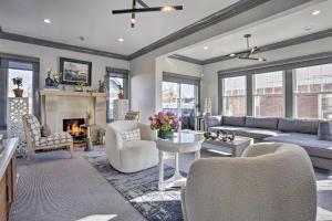 a living room with a couch and a fireplace at Classic Teaneck Colonial Home with A Modern Touch in Teaneck