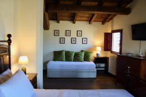 a bedroom with a bed and a television in it at Palazzo Minelli in Sala Bolognese +73 photos