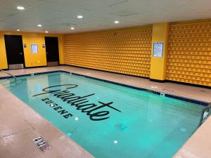 a swimming pool with the university of texas logo on it at Graduate Eugene in Eugene