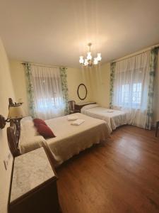 Postel nebo postele na pokoji v ubytování Casa Rural la Abuela Amelia