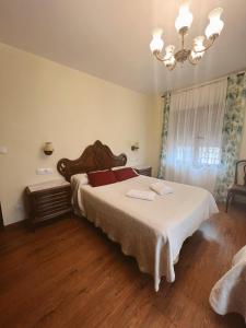 Postel nebo postele na pokoji v ubytování Casa Rural la Abuela Amelia