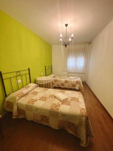 Postel nebo postele na pokoji v ubytování Casa Rural la Abuela Amelia