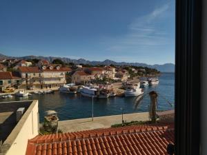 a view of a harbor with boats in the water at Apartments Maja i Mate in Sućuraj