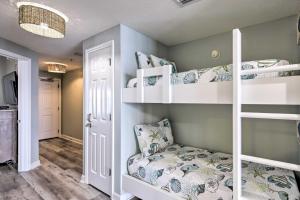 a room with three bunk beds and a couch at Panama City Beach Condo w/ Free Beach Service! in Panama City Beach +19 photos