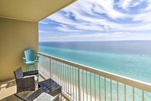 a balcony with chairs and a view of the ocean at Panama City Beach Condo w/ Free Beach Service! in Panama City Beach