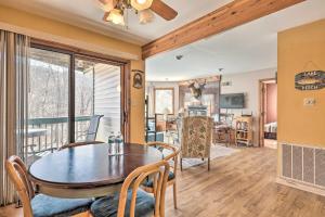 a dining room and living room with a table and chairs at Next to Shawnee Mtn Ski Area Inviting Condo! in East Stroudsburg