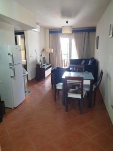 A kitchen or kitchenette at Amazing view apartment in Golf Porto Marina with marina access
