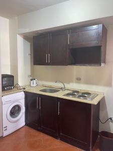 A kitchen or kitchenette at Amazing view apartment in Golf Porto Marina with marina access