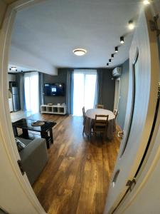 A television and/or entertainment centre at Dune Apartment Nessebar