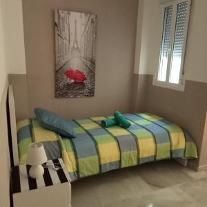 Posteľ alebo postele v izbe v ubytovaní Apartamentos centro histórico