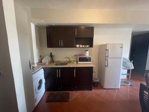 A kitchen or kitchenette at Amazing view apartment in Golf Porto Marina with marina access