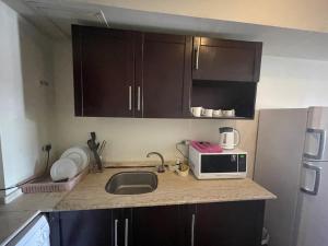 A kitchen or kitchenette at Amazing view apartment in Golf Porto Marina with marina access