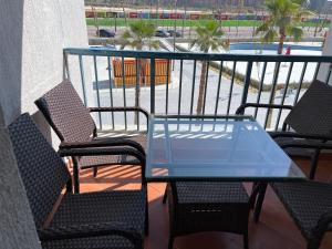 A balcony or terrace at Amazing view apartment in Golf Porto Marina with marina access
