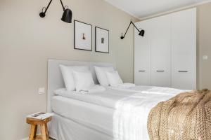 Posteľ alebo postele v izbe v ubytovaní Live & Travel Old Town Apartments