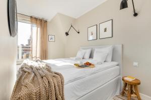 Posteľ alebo postele v izbe v ubytovaní Live & Travel Old Town Apartments