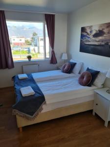 Postel nebo postele na pokoji v ubytování Höfn Guesthouse