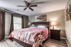 a bedroom with a bed and a ceiling fan at Quiet and Serene Condo in Branson in Branson