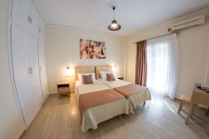 Giường trong phòng chung tại Eleonas Holiday Home Apartment