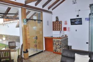TV a/nebo společenská místnost v ubytování Hostal Goya Andina