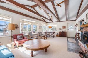 a living room with a table and a couch at Johnson Cottage in Glenn