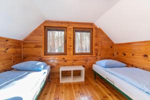 Кровать или кровати в номере Sława Family Resort