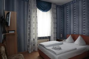 Postel nebo postele na pokoji v ubytování Hotel Sessellift