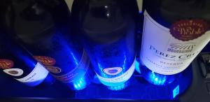 a group of bottles of beer with blue lights at Pousada das Orquídeas in Chapada dos Guimarães