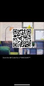a qr code picture of a living room with a tv at Canterbury Comfy 6 Bed House with Hot Tub - Entire House in Canterbury