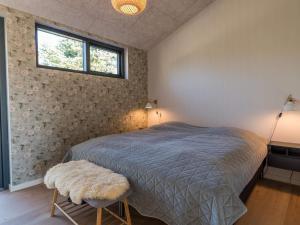 Holiday home Fanø CC tesisinde bir odada yatak veya yataklar