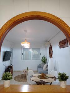 an archway in a living room with a table and chairs at Mar Menor, La Manga Strip/Best view + Pool in San Blas