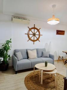 a living room with a blue couch and a table at Mar Menor, La Manga Strip/Best view + Pool in San Blas